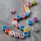12 Packs: 32 ct. (384 total) Multicolor Ceramic Smiley Face Beads, 7.5mm by Bead Landing™